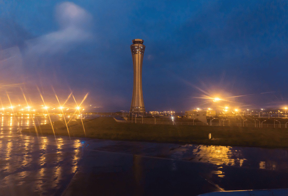 A well-lit airfield that uses monitoring systems for aeronautical ground lighting.